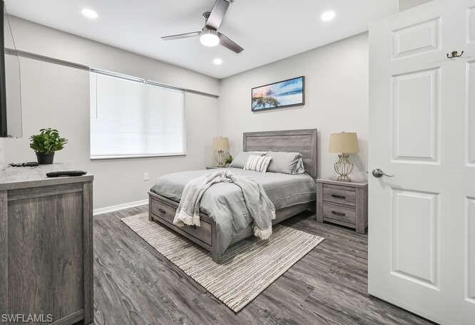 7935 Mahogany Run Lane, Unit 725 Naples, FL 34113 - Photo 23 of 27 a bedroom with double bed and a window