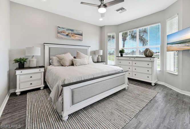 7935 Mahogany Run Lane, Unit 725 Naples, FL 34113 - Photo 26 of 27 a bedroom with a large bed and a window