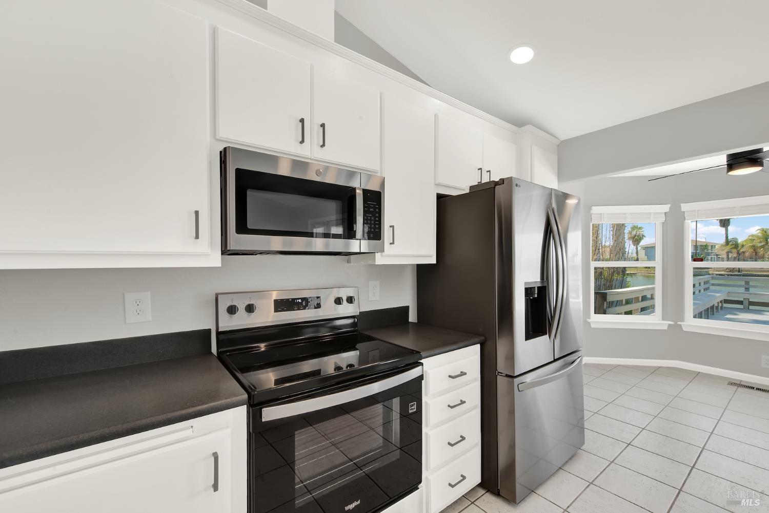 1270 Willow Lake Road Discovery Bay, CA 94505 - Photo 12 of 29 a kitchen with a stove a refrigerator and a sink