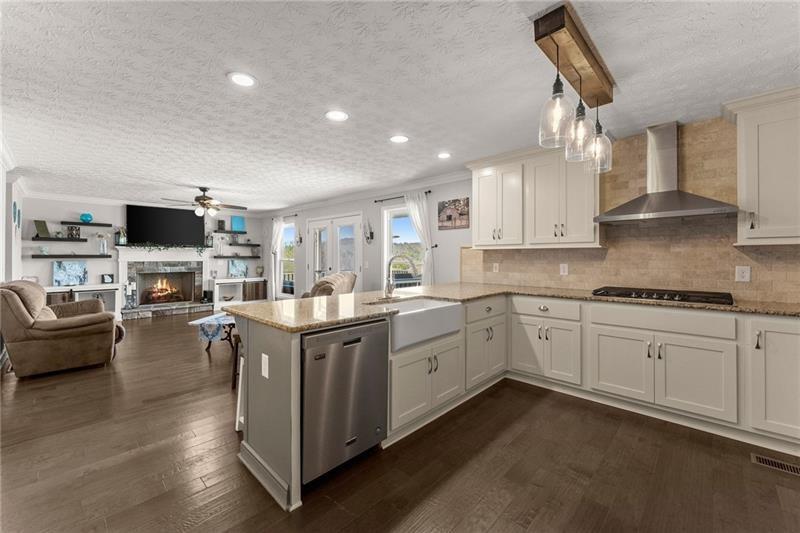 4295 Porter Springs Road Dahlonega, GA 30533 - Photo 13 of 55 a kitchen with sink cabinets and flat screen tv