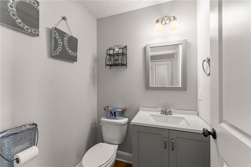 4295 Porter Springs Road Dahlonega, GA 30533 - Photo 18 of 55 a bathroom with a toilet sink and mirror