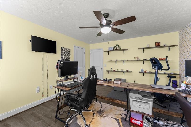 4295 Porter Springs Road Dahlonega, GA 30533 - Photo 33 of 55 a workspace with wooden floor and a cabinet