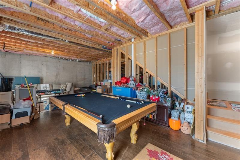 4295 Porter Springs Road Dahlonega, GA 30533 - Photo 36 of 55 a room with furniture and wooden floor