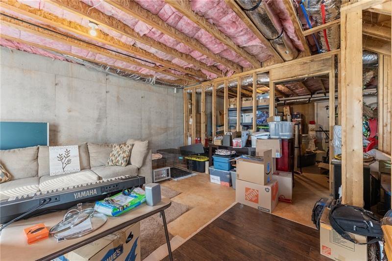 4295 Porter Springs Road Dahlonega, GA 30533 - Photo 37 of 55 a living room with furniture and a chandelier