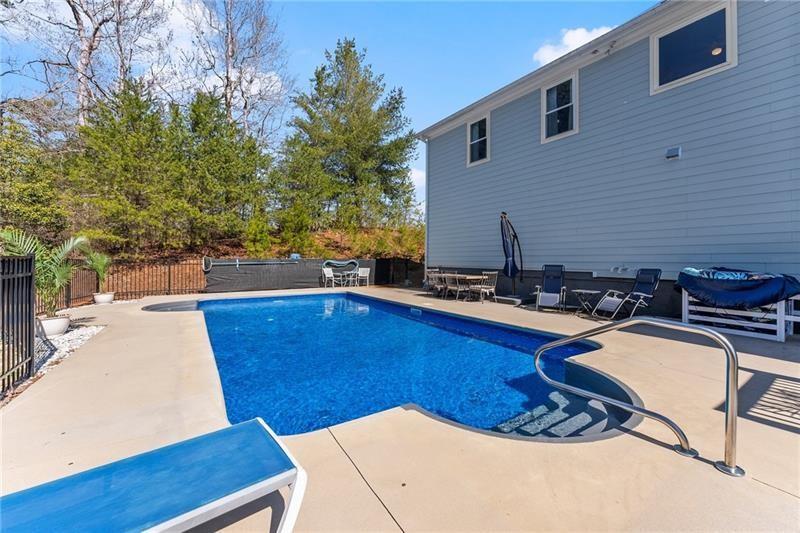 4295 Porter Springs Road Dahlonega, GA 30533 - Photo 41 of 55 a view of a kitchen with swimming pool and sitting area