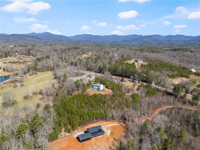 4295 Porter Springs Road Dahlonega, GA 30533 - Photo 47 of 55 a view of a lake in middle of forest