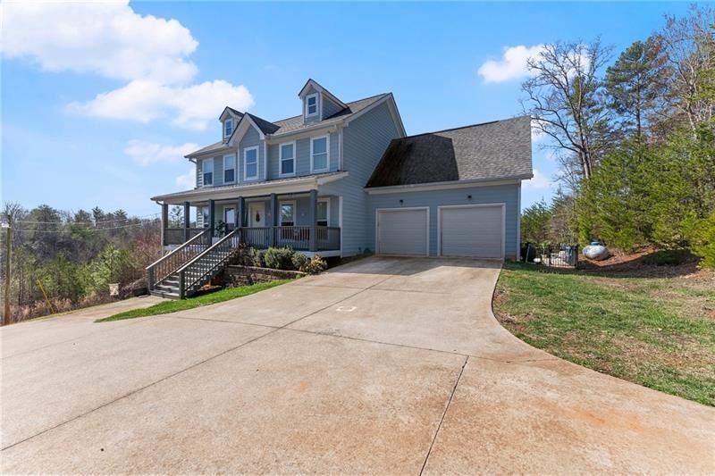 4295 Porter Springs Road Dahlonega, GA 30533 - Photo 5 of 55 a view of a house with a yard and potted plants