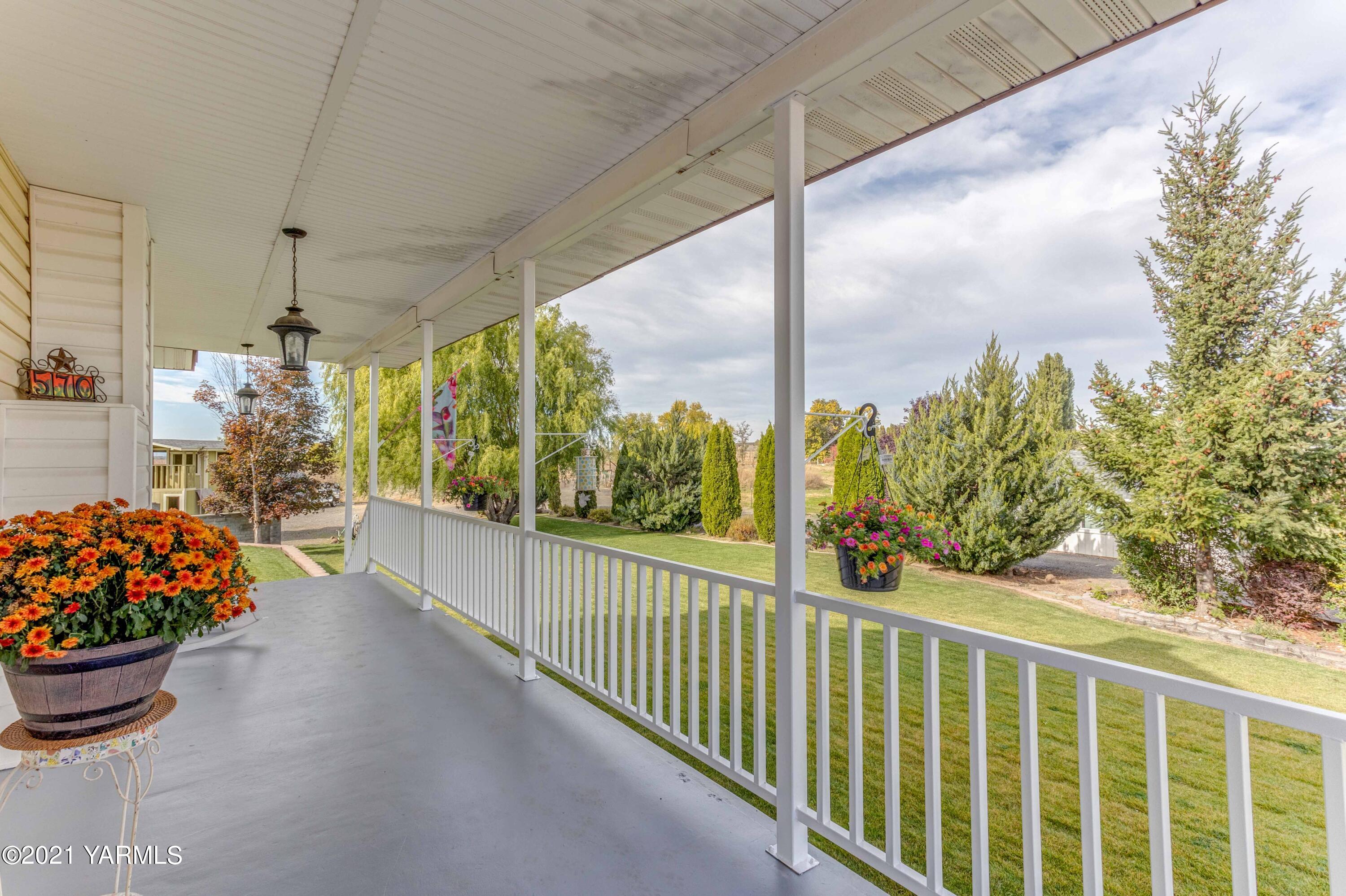 570 Chase Road Grandview, WA 98930 - Photo 1 of 42 a view of a porch with a potted plant
