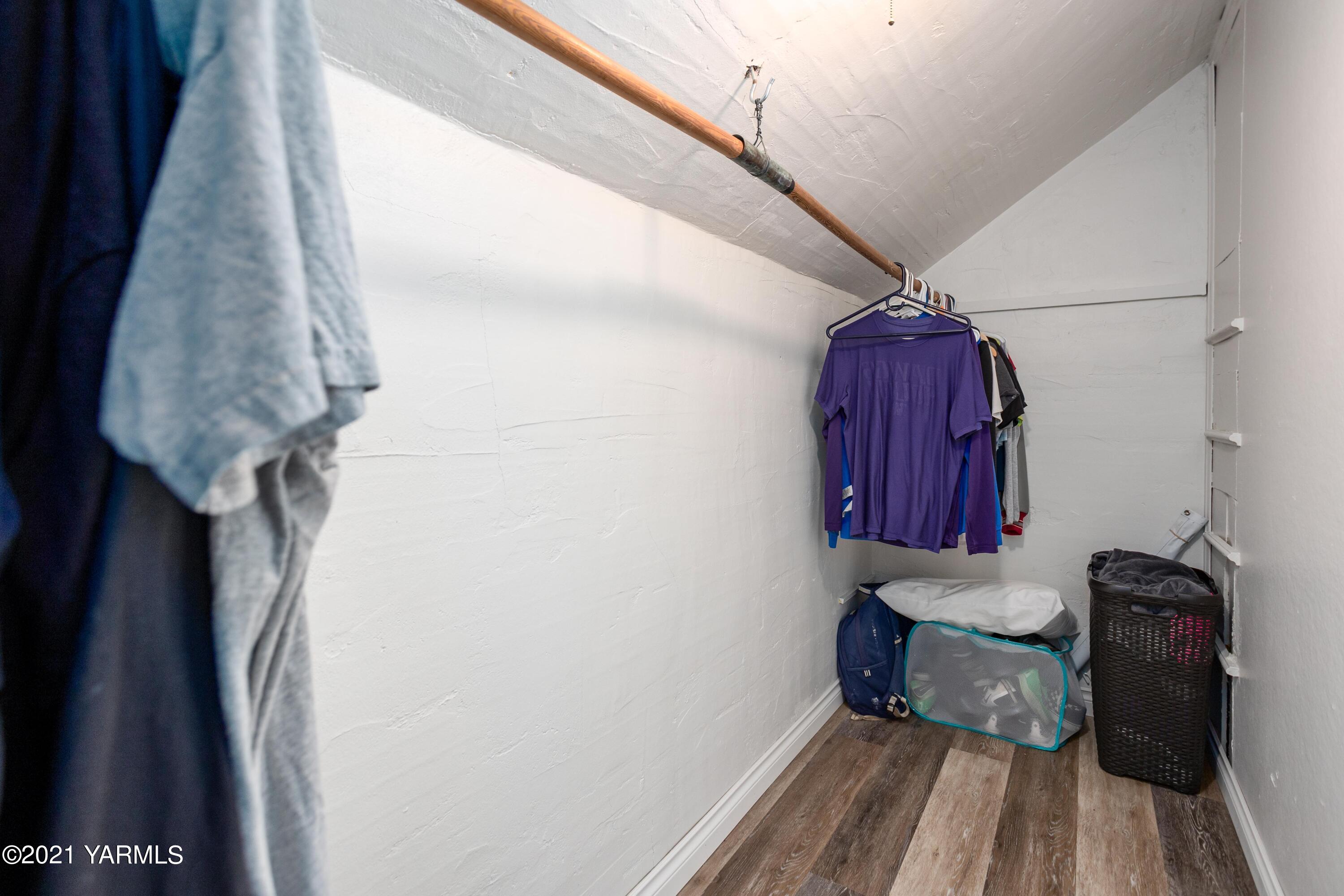 570 Chase Road Grandview, WA 98930 - Photo 17 of 42 a room with a walk in closet and a window