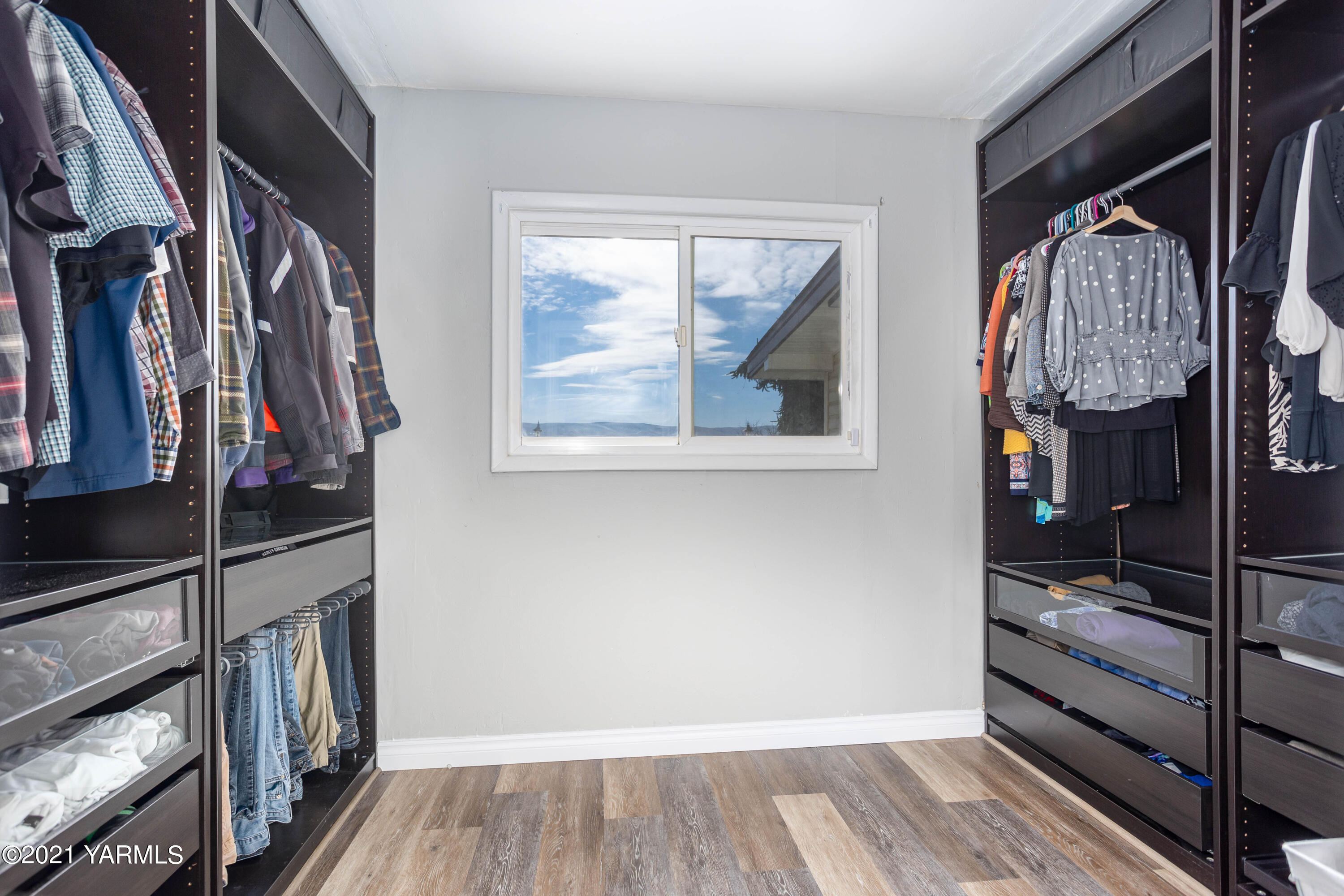 570 Chase Road Grandview, WA 98930 - Photo 24 of 42 a view of walk in closet with clothes and shoes
