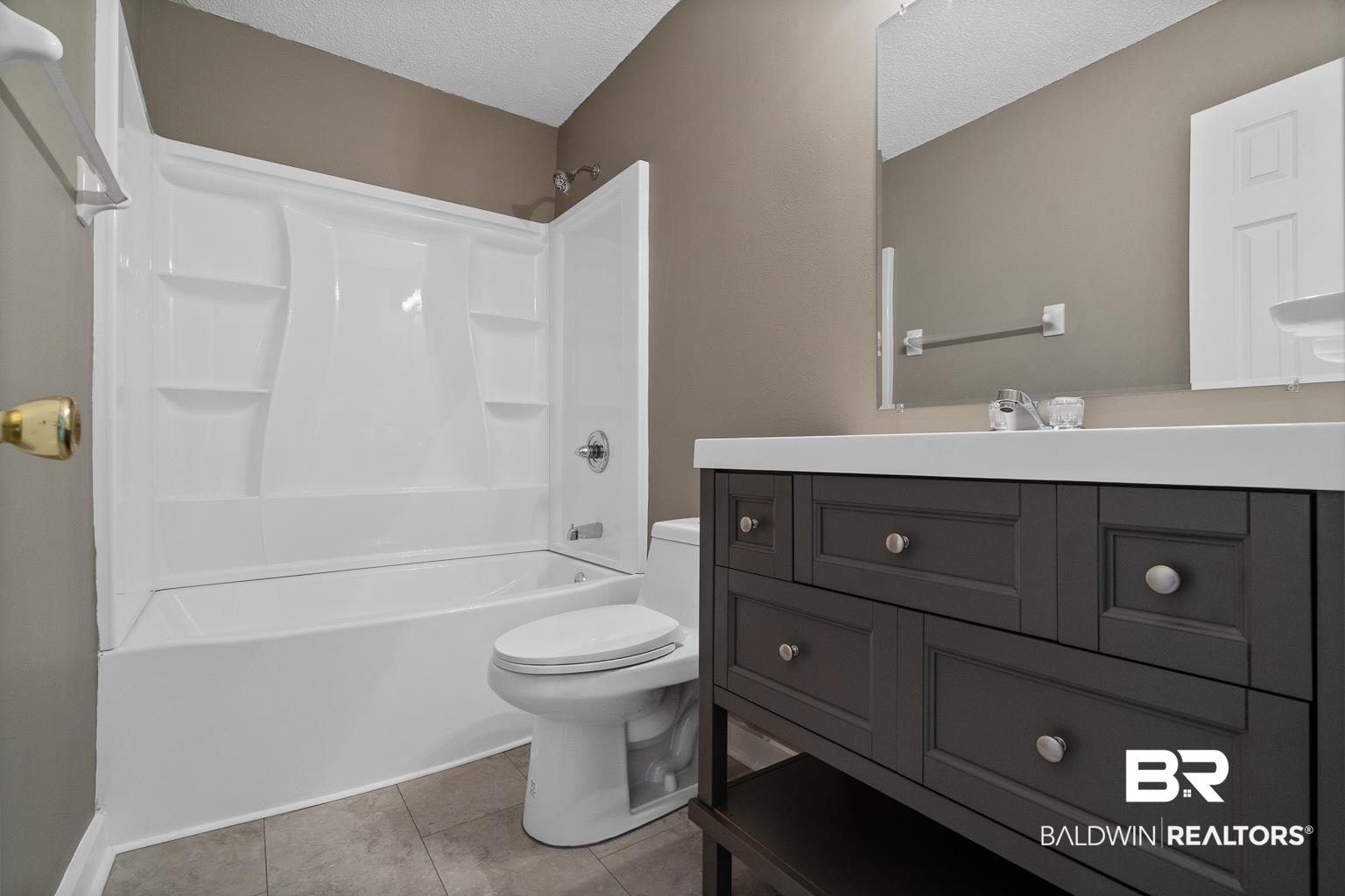 16418 Avent Lane Foley, AL 36535 - Photo 30 of 30 Full bathroom with vanity, toilet, tub / shower combination, a textured ceiling, and tile patterned flooring
