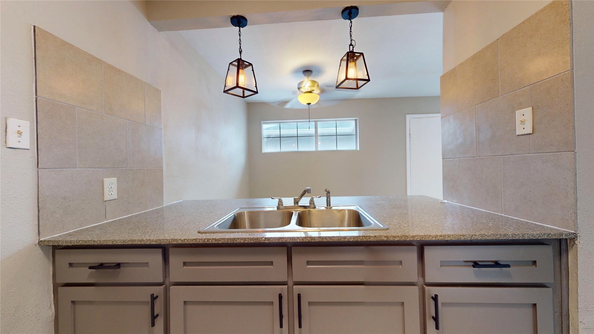 5017 Mallow Street Houston, TX 77033 - Photo 12 of 30 a view of room with a sink and wooden floor