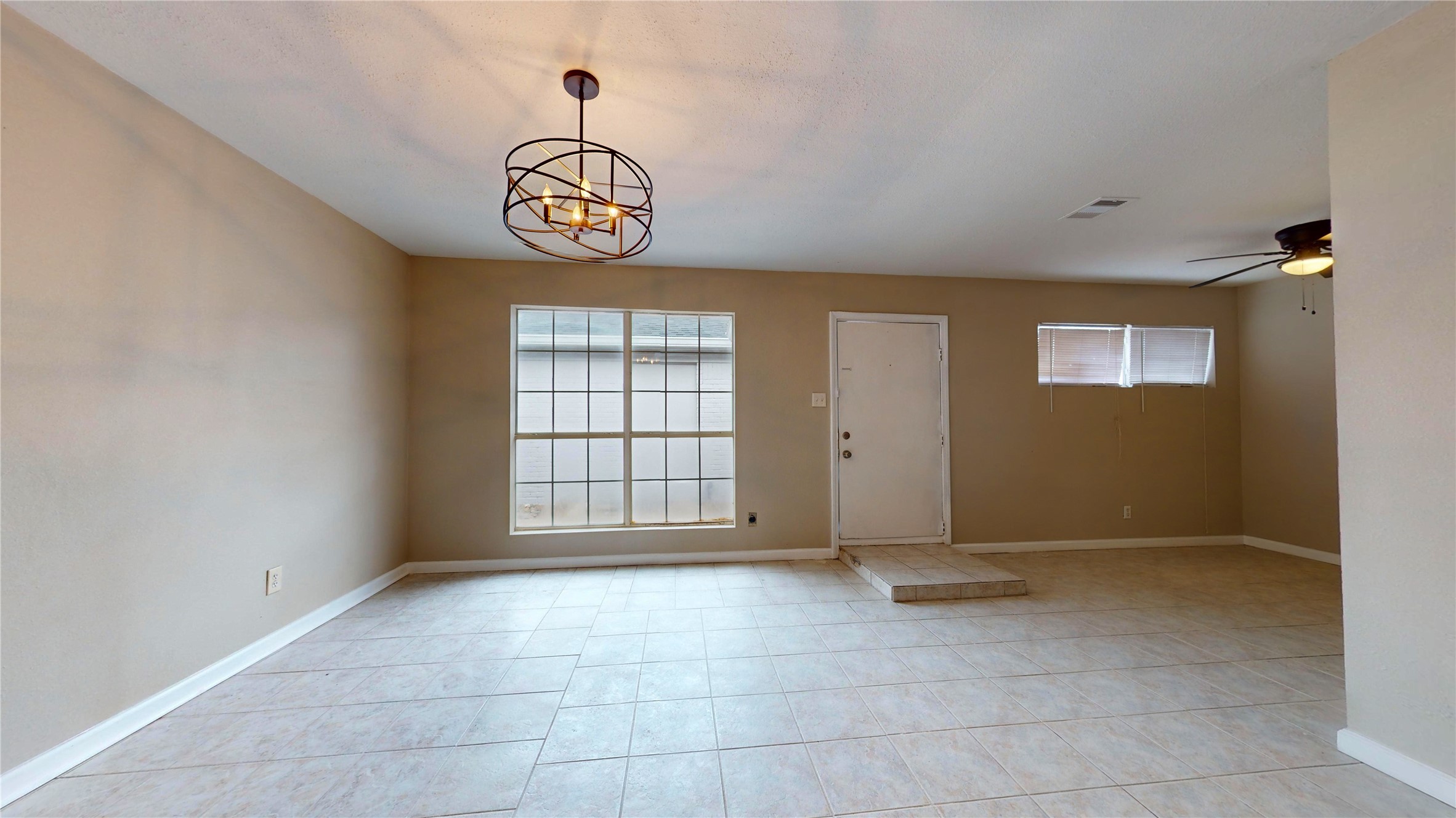 5017 Mallow Street Houston, TX 77033 - Photo 15 of 30 an empty room with windows