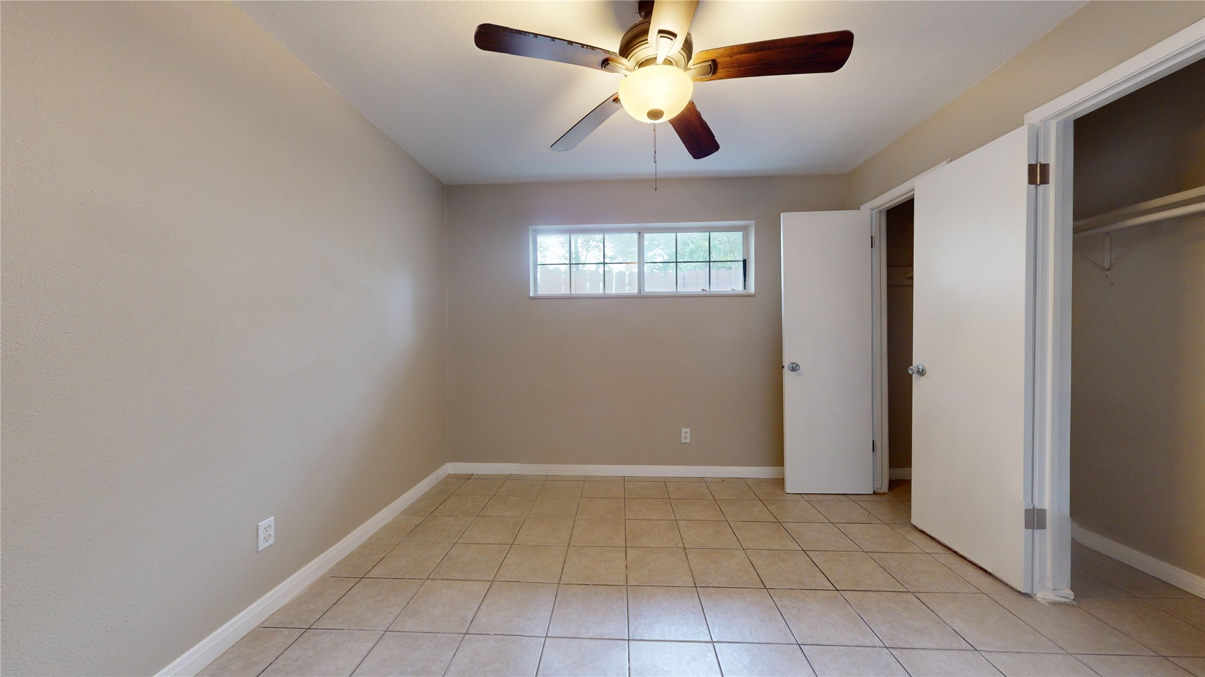 5017 Mallow Street Houston, TX 77033 - Photo 29 of 30 a view of an empty room with a window