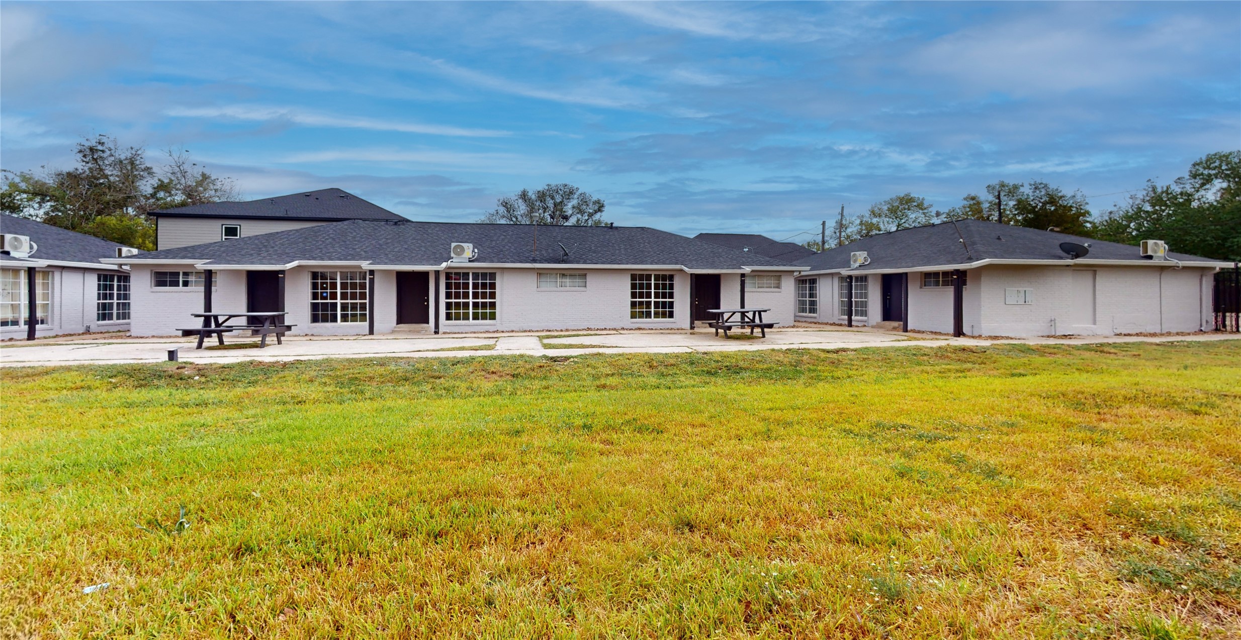 5017 Mallow Street Houston, TX 77033 - Photo 9 of 30 a front view of a building with swimming pool having outdoor seating