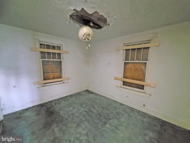 en empty room with windows