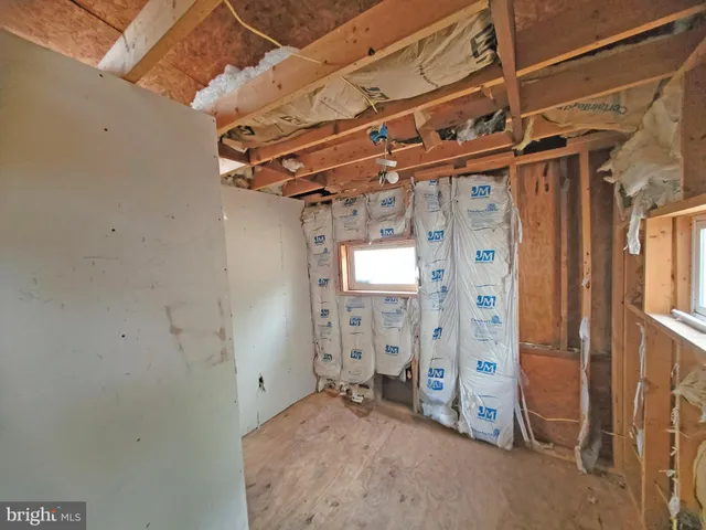 an empty room and chandelier fan fire place