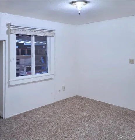 a view of a chandelier in an empty room