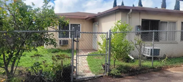 a kitchen with a sink and a stove top oven