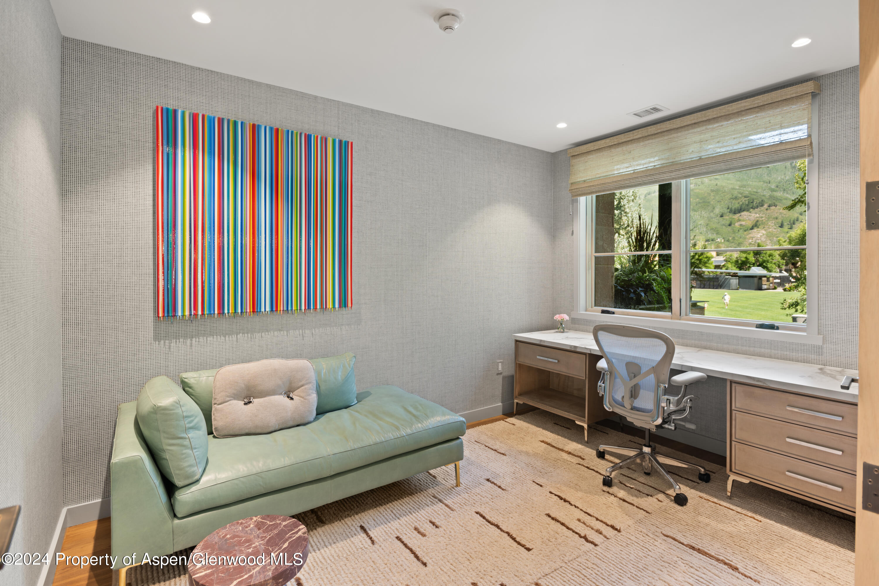 405 South Monarch Street, Unit 209 Aspen, CO 81611 - Photo 3 of 33 a living room with furniture and a window