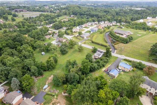 an aerial view of residential house with outdoor space and river