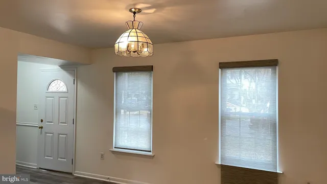 a view of a hallway with windows