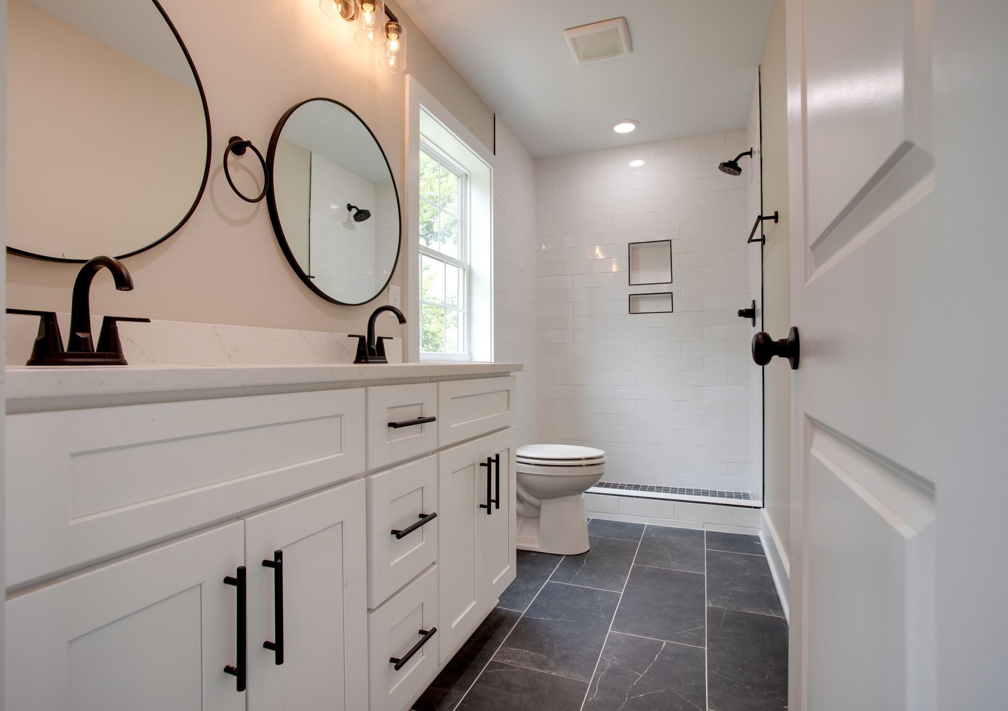 513 Transit Avenue Columbia, TN 38401 - Photo 13 of 26 a bathroom with a toilet a sink and a mirror