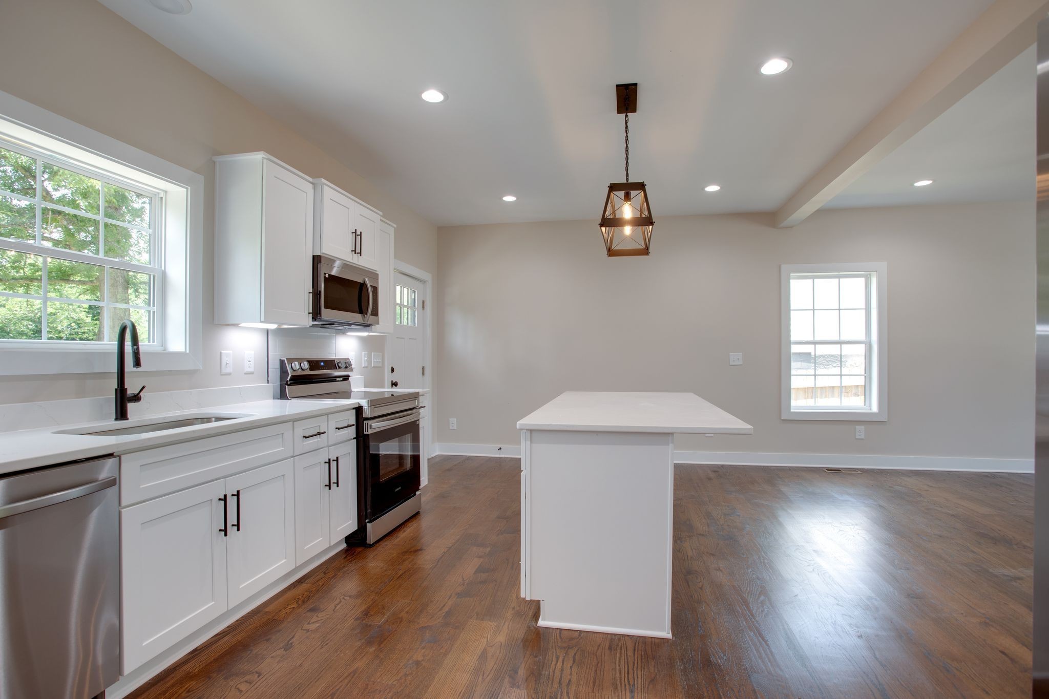 513 Transit Avenue Columbia, TN 38401 - Photo 5 of 26 a kitchen with a sink a window stainless steel appliances and cabinets