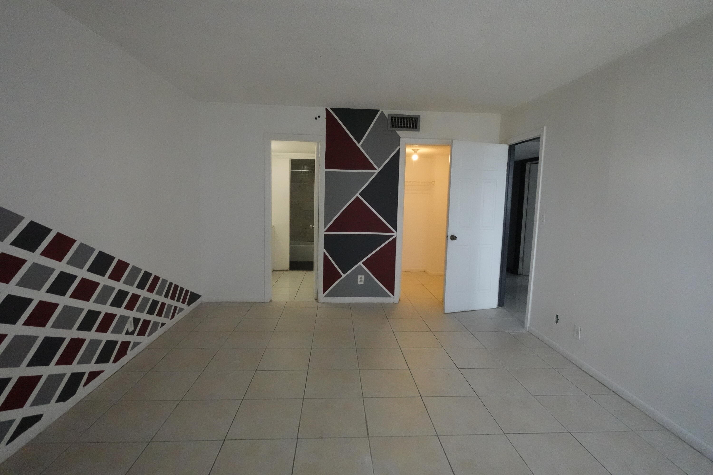 4200 Inverrary Boulevard, Unit 3516 Lauderhill, FL 33319 - Photo 14 of 19 a view of room with staircase