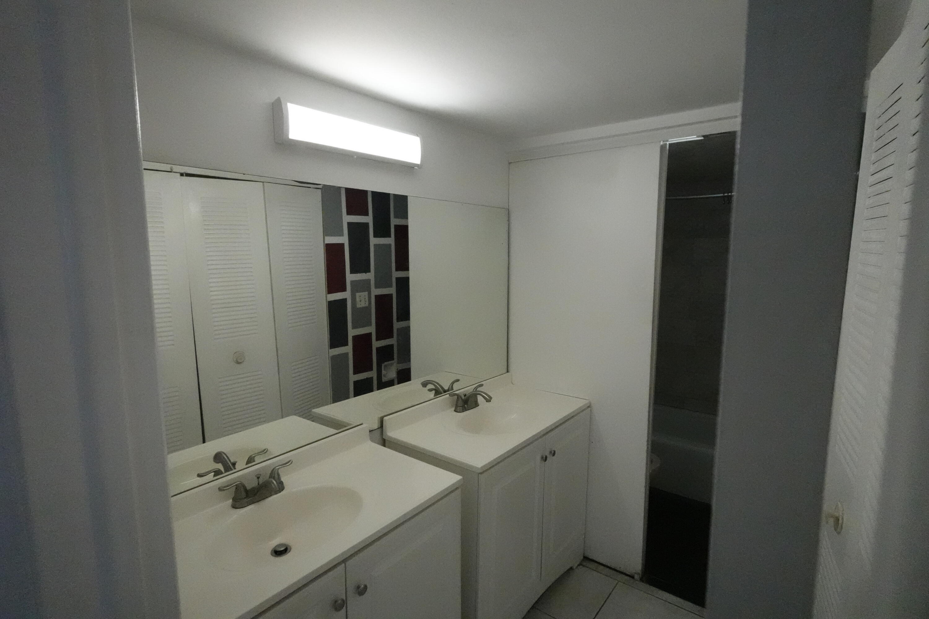 4200 Inverrary Boulevard, Unit 3516 Lauderhill, FL 33319 - Photo 16 of 19 a bathroom with a sink toilet and shower