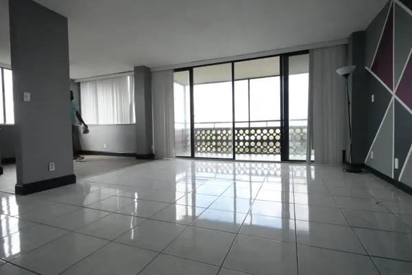 a view of an empty room with a window