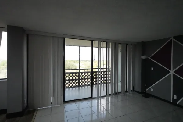 a view of a closet area with an empty room