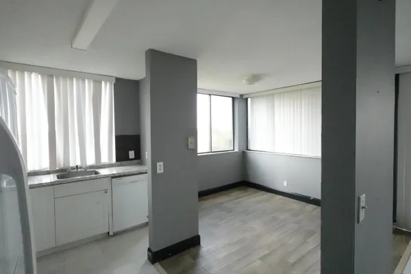 a view of an empty room with a window