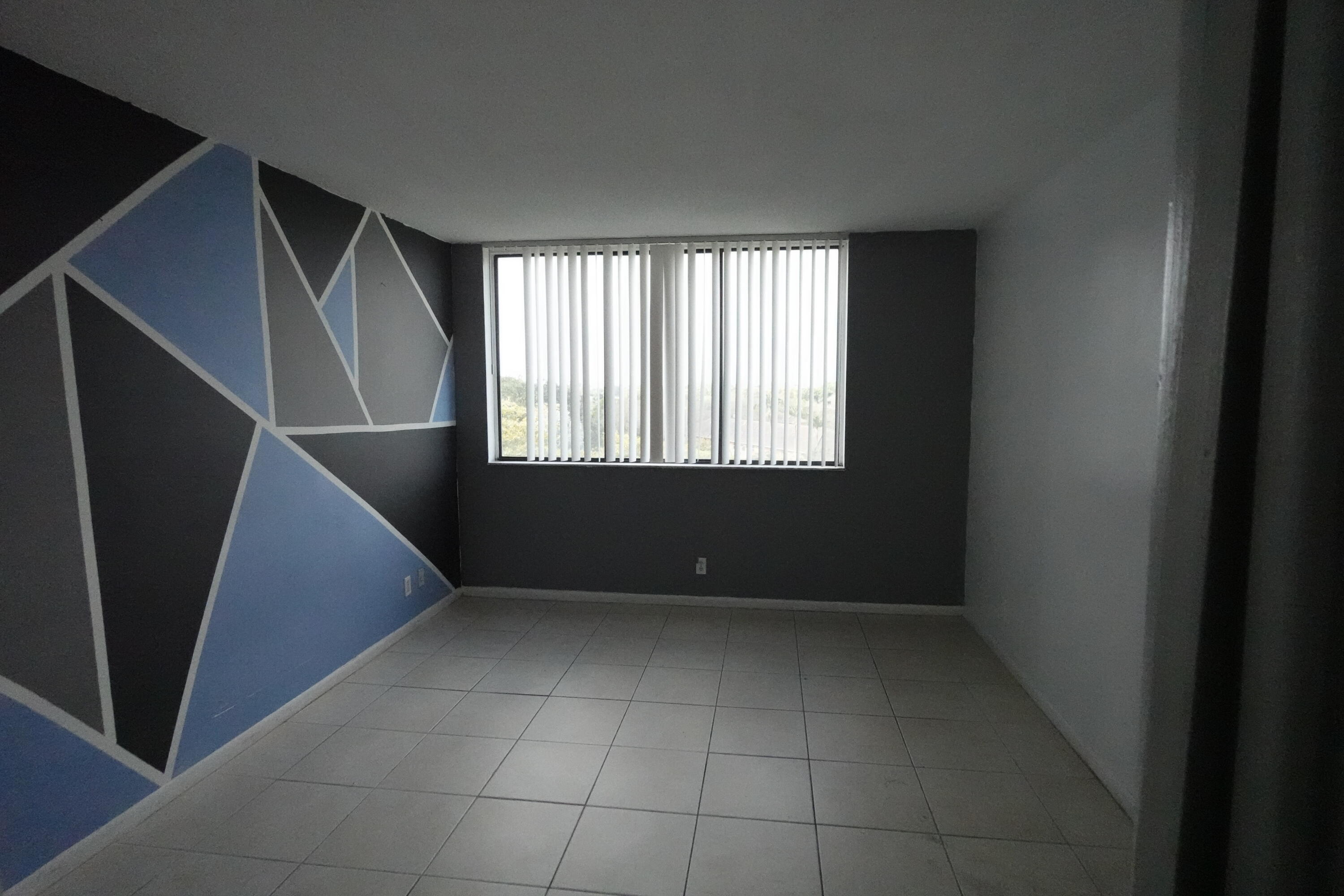 4200 Inverrary Boulevard, Unit 3516 Lauderhill, FL 33319 - Photo 9 of 19 a view of an empty room with a window