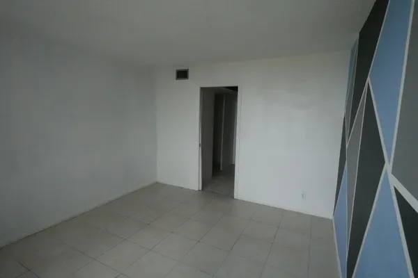 an empty room with an entryway