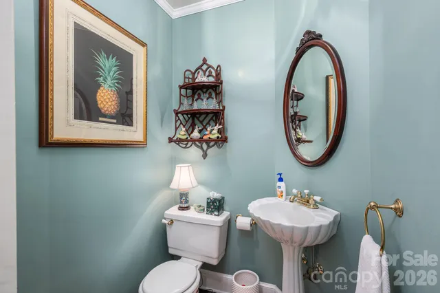 a bathroom with a toilet and a sink
