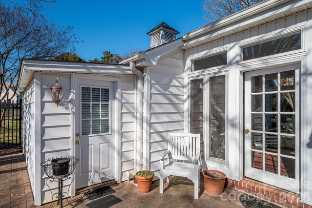 a front view of a house with outdoor seating