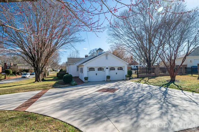 a view of a house with a yard covered with snow in front of house
