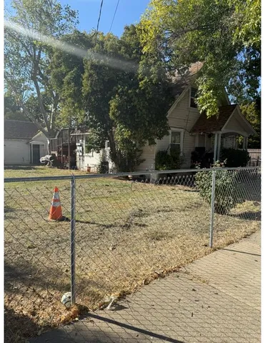 a view of a yard covered in snow