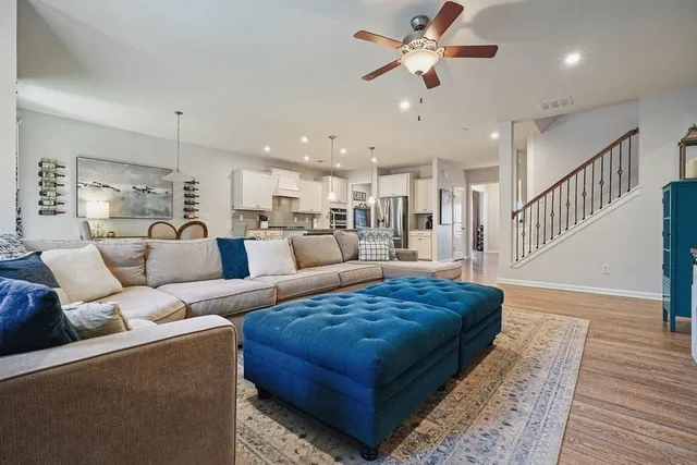 a living room with furniture and a large window