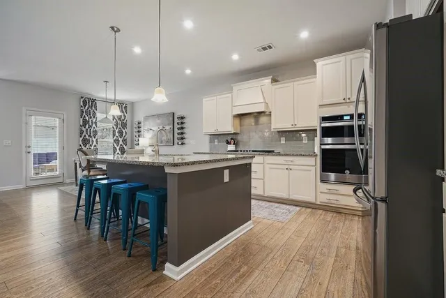 a bedroom with a bed couch and window