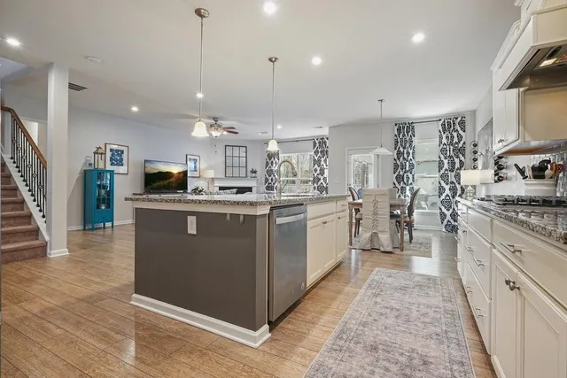a view of a livingroom with furniture and a flat screen tv