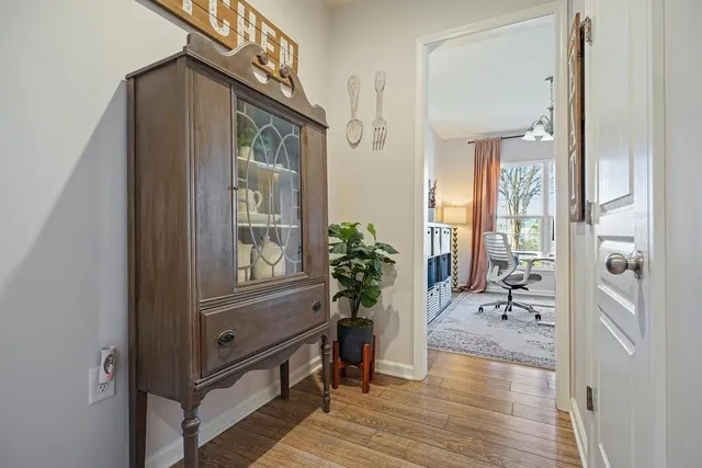 a view of a livingroom with furniture and a large window