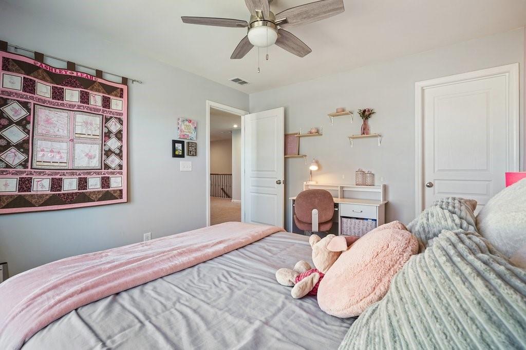451 Timberleaf Road Canton, GA 30115 - Photo 26 of 38 a bedroom with a bed and wooden floor