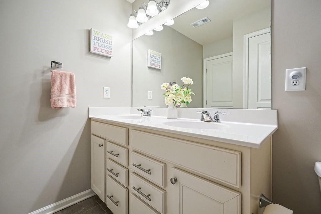 451 Timberleaf Road Canton, GA 30115 - Photo 28 of 38 a bathroom with a sink vanity and mirror