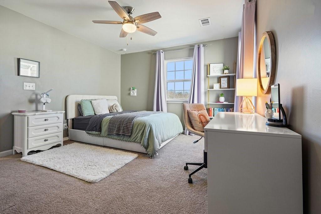 451 Timberleaf Road Canton, GA 30115 - Photo 29 of 38 a bedroom with furniture and a window