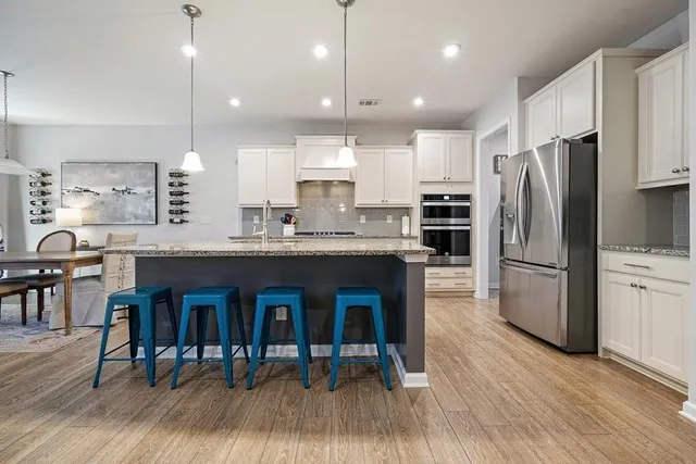 a living room with furniture a ceiling fan and a rug