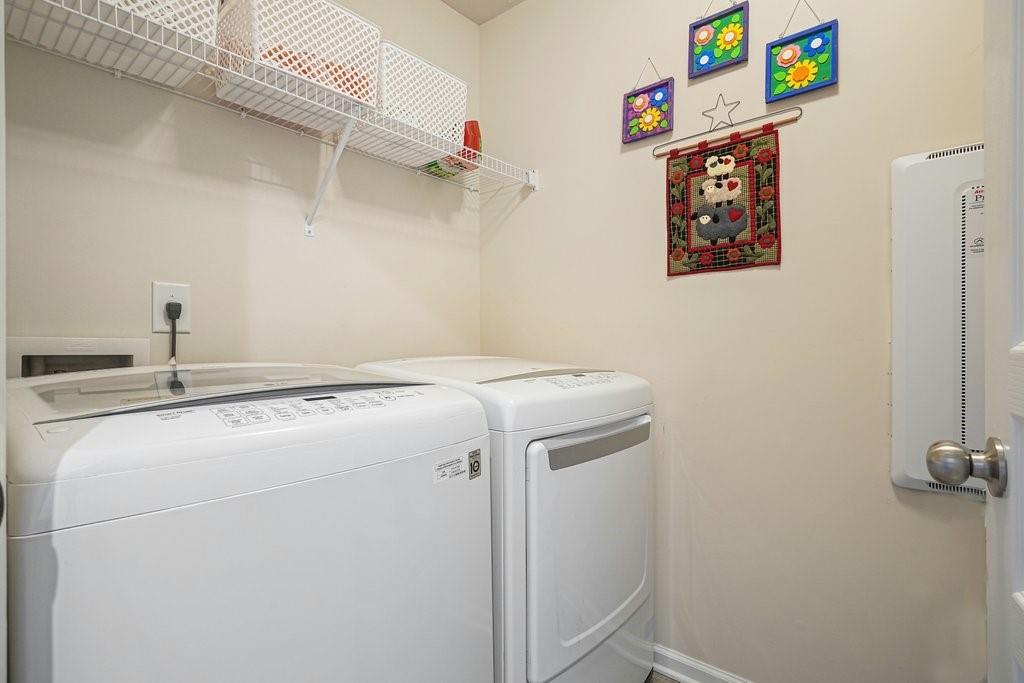 451 Timberleaf Road Canton, GA 30115 - Photo 37 of 38 a utility room with dryer and washer