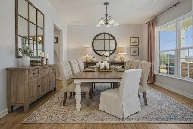 a kitchen with stainless steel appliances granite countertop a sink a stove and cabinets