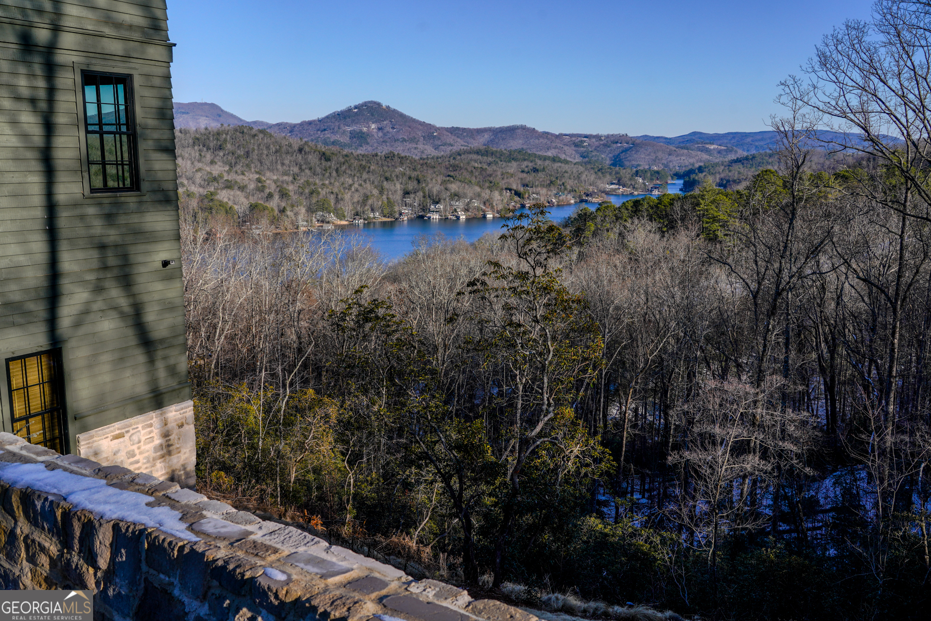 814 Summit Ridge Drive Clarkesville, GA 30523 - Photo 14 of 85 a view of a lake with a mountain in the background